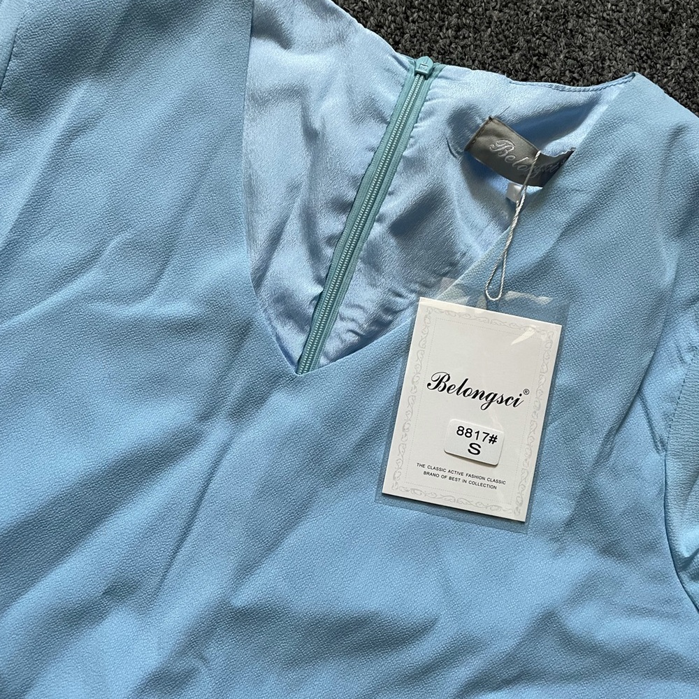 Light blue flowy dress with wide sleeves